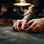 A croupier's hands meticulously examining a pair of unmarked casino dice on dark green felt